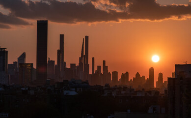 Fototapeta na wymiar Sun setting over skyscrapers in NYC Long Island City Queens 