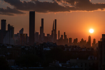 Fototapeta na wymiar Sun setting over skyscrapers in NYC Long Island City Queens 
