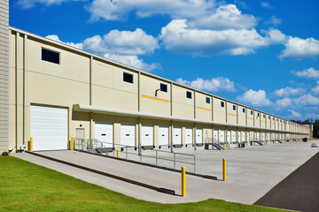 Large generic white industrial storage warehouse façade