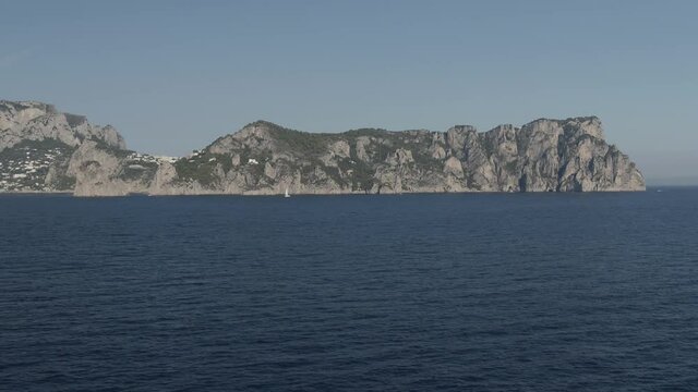 Aerial Drone footage view of Faraglioni Rocks in Sea in Capri Naples Costiera Amalfitana Italy Europe // no video editing
