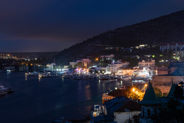Naklejka na ściany i meble Crimea Balaclava. The view at night of the city from the mountains.