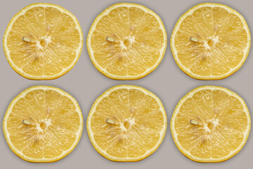 Fototapeta na wymiar Lemon slices on gray background