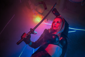 Cyberpunk woman warrior with a katana sword in the neon lights concept.