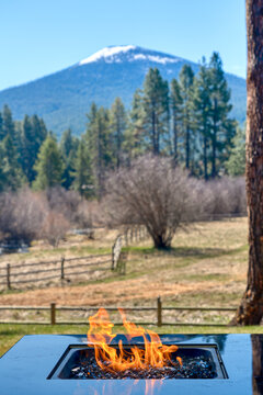 Outdoor Gas Fire Place With A Mountain In The Background