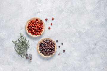 Fototapeta na wymiar Dried juniper berries in a small bowl.
