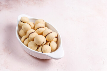 Baci di dama homemade Italian hazelnut biscuits cookies with chocolate.