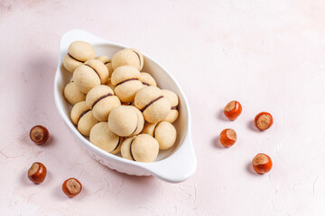 Baci di dama homemade Italian hazelnut biscuits cookies with chocolate.