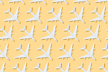 top view of pattern of white airplanes on a yellow background. Travel and summer concept. 3d illustration