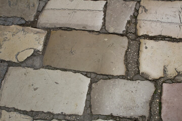 Natural background. Gray stone pavement. Close-up.