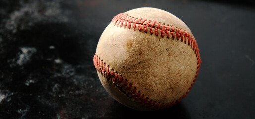 old game baseball on dark grunge sports background