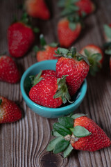 Red strawberries on the wooden table