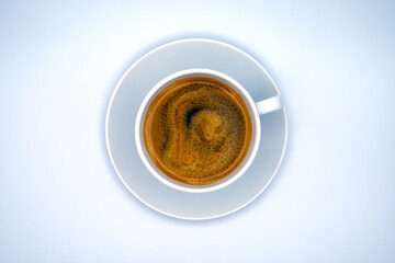 A white cup of coffee (Caffè Crema) against a clean, white background
