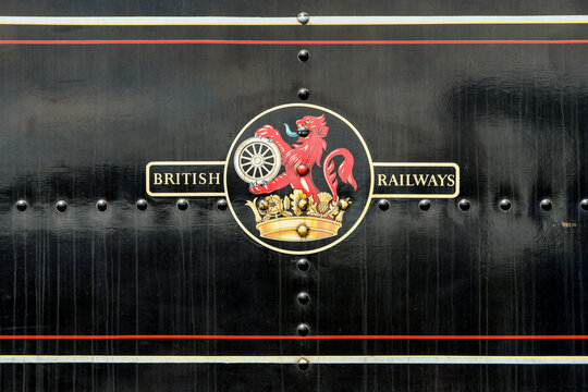 Cranmore, Somerset, England - July 2019: Close up view of the old British Railways logo on the side of a steam engine on the East Somerset Railway.
