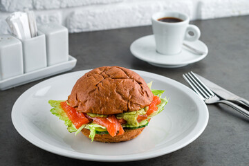 Healthy Salmon Burger with Avocado served