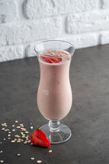 Fresh strawberry milkshake with strawberry slice