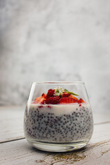 Dessert made of lactose-free milk with chia seeds and strawberries
