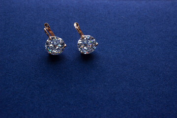 Diamond earrings jewelry, luxury silver earrings with diamond, sapphires in black background.