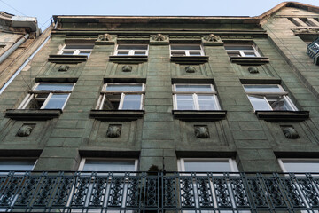  The sun lights the city street and typical architectural parts of house