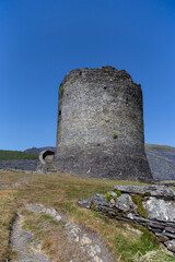 Dolbadarn Castle in Llanberis, Gwynedd,  North Wales.  Medieval castle on a hill with a blue sky