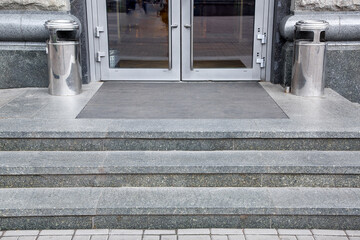 granite gray threshold steps with a foot mat at the entrance to the front door made of tempered...