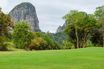 Golf course with limestone mountains in the background