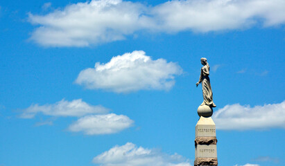 statue of angel in the sky