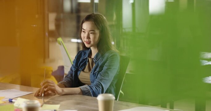 Asian female human resources manager taking interview from job candidate. Young company worker or student working at modern office 4k footage