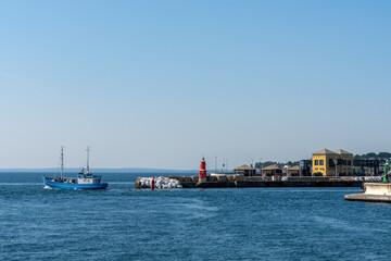 fishing boat leaves the harbor of Helsingor