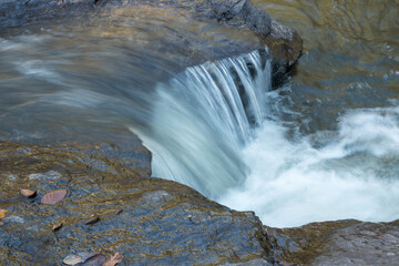 Water rushing down the Rio das Almas that feeds the Waterfall Meia Lua (Half Moon Waterfall) outside the city of Pirenopolis, Brazil