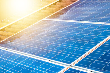 Solar worker cleaning photovoltaic panels with brush and water. Photovoltaic cleaning, before and after concept  image. Space for text.