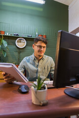 young person explaining homework to his teacher through camera