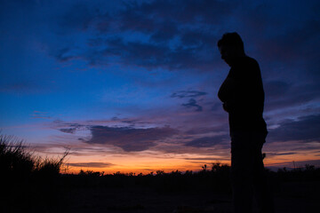 silhouette of a person in the sunset