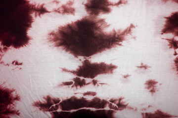 Red and white tie dye fabric background