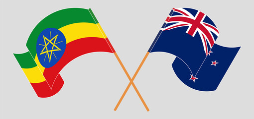 Crossed and waving flags of Ethiopia and New Zealand