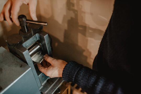 Crop jeweler making ring