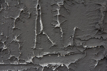 Facade plaster background. Dark background of the building facade. Plaster