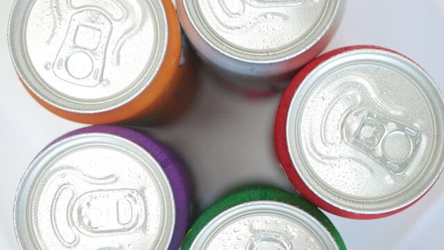 Various Cold, Sweet, and Carbonated Refreshing Drinks. Shooting with Refreshing Pop Can Drinks.