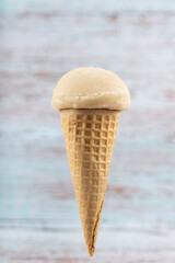 Tasty vanilla ice cream cone.