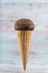 Tasty chocolate flavored ice cream cone.