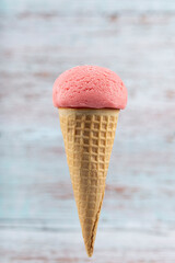 Tasty strawberry ice cream cone.