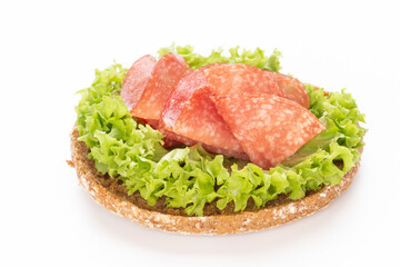 Sandwich with salami sausage on white background.