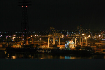 Fototapeta na wymiar mercantile port by night illuminated big shot