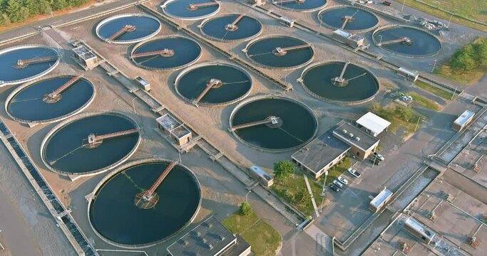 Aerial view of the solid clarifier tank type sludge recirculation in water treatment plant in near big city