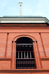 Obraz premium Bells in the church. Red brick church