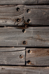 Aged wood boards held by rusty nails