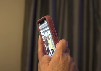 Hands holding a cellphone