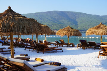 Bodrum, Turkey - August, 2020 Lujo Hotel, Tropical paradise beach with white sand and coco palms travel tourism wide panorama background. Luxury vacation and holiday banner, tropical beach resort
