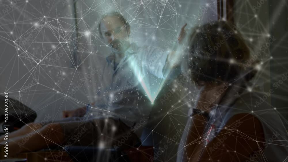 Aufkleber animation of glowing network of connections floating over work colleagues in discussion