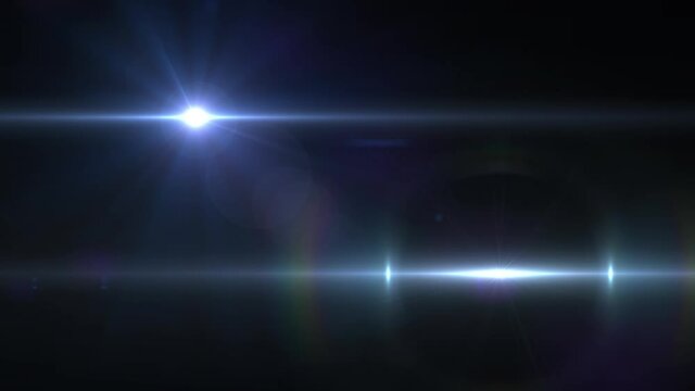 Animation of two beams of white light and lens flare moving on black background