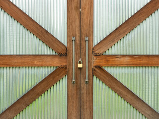 The barn door has a wooden structure like the Union Jack flag.